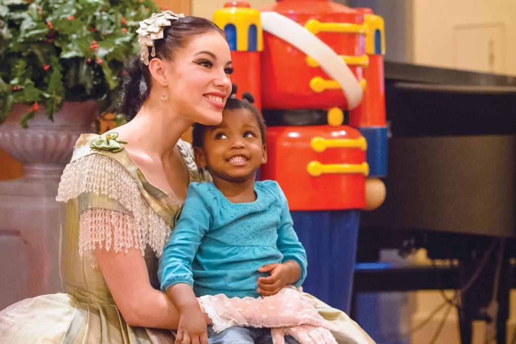 The Milwaukee Ballet’s Itzel Hernandez befriends a young visitor before a 2016 performance of The Nutcracker