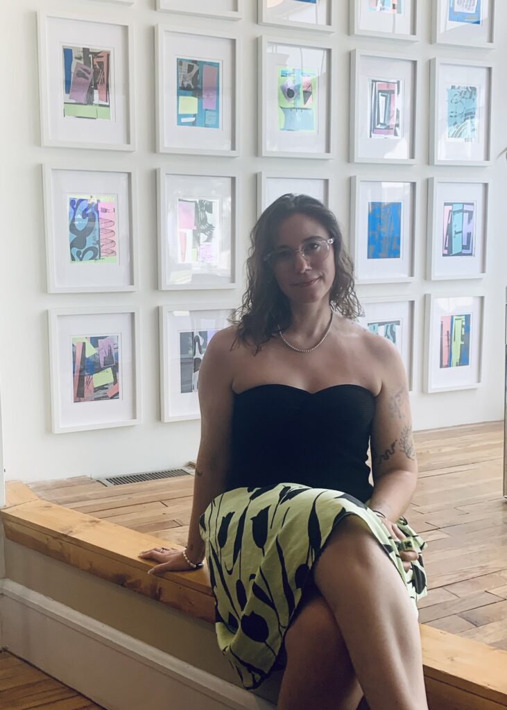 Sarah Jane Sutterfield poses in front of her art at River Press in Riverwest, Milwaukee.