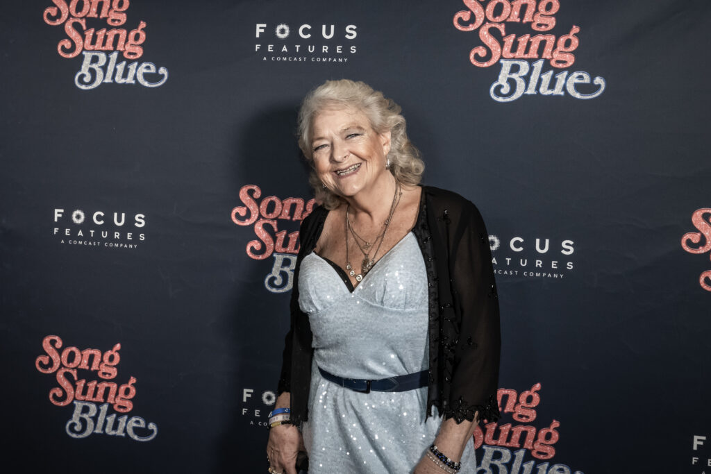 A photo of Claire Sardina, aka "Thunder" at the Milwaukee premiere of Song Sung Blue