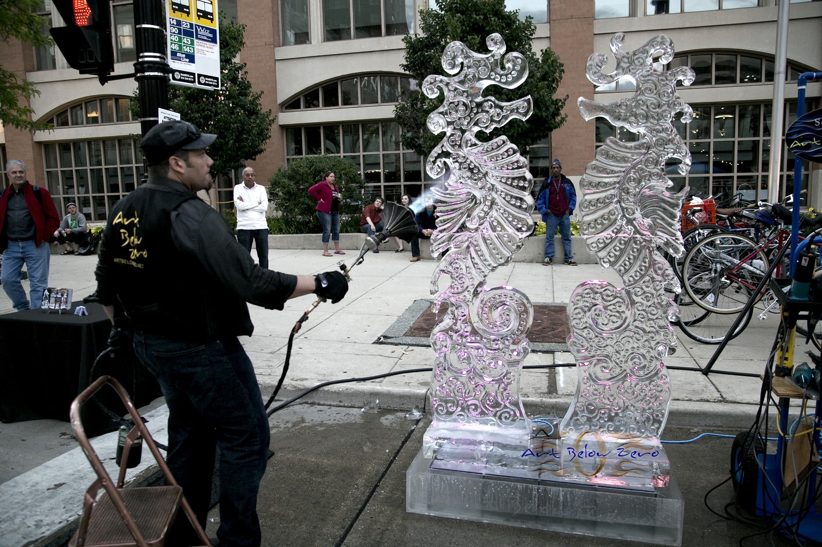 Max Zuleta carving an ice sculpture of two dragons in downtown Milwaukee.