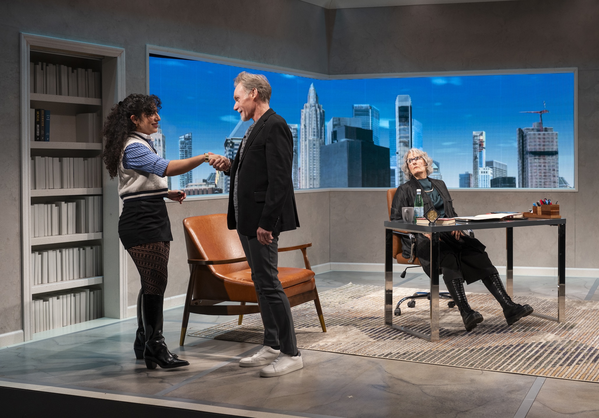 Peter Bradbury shakes the hand of Sara Sadjadi in the Milwaukee Rep production of "McNeal."