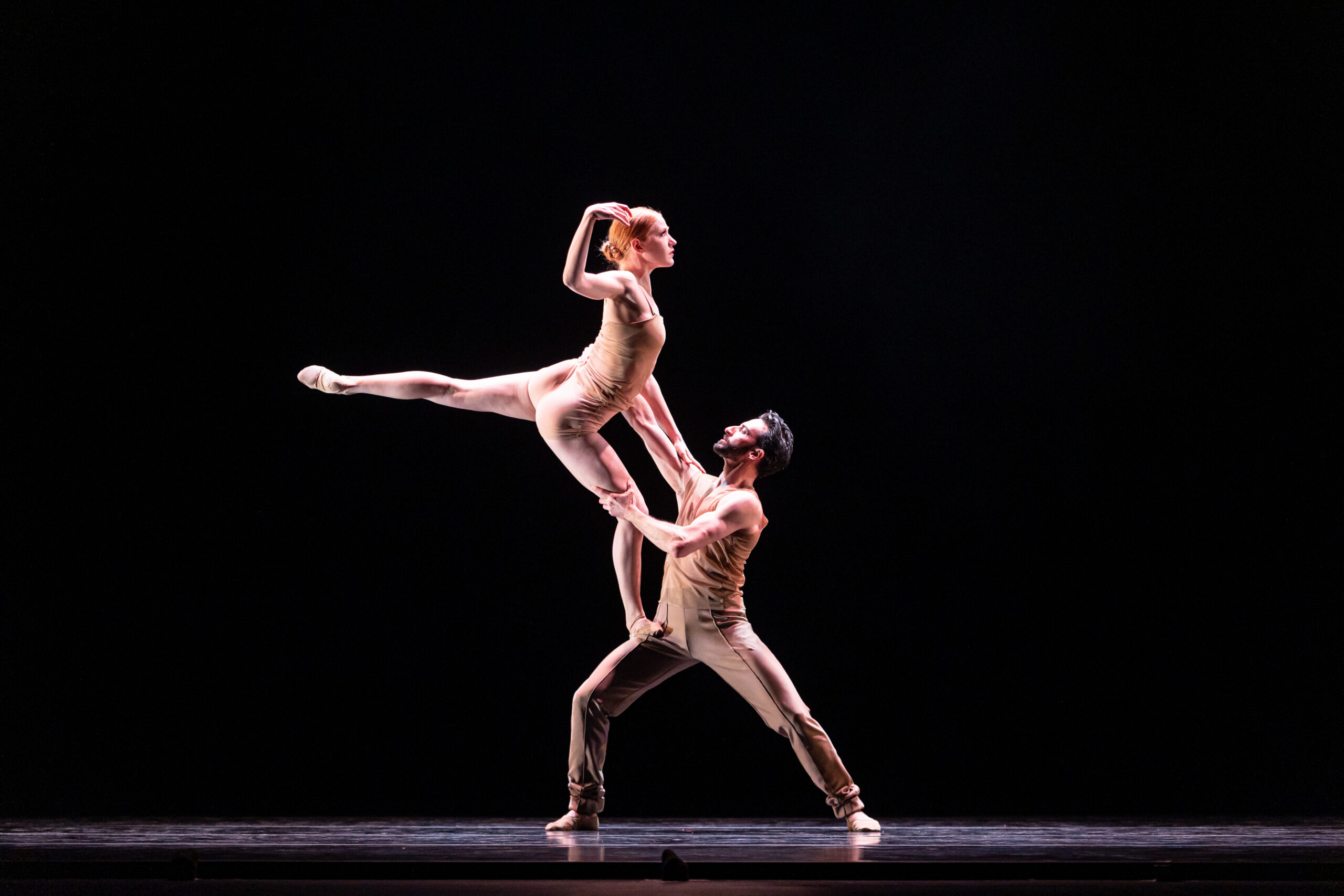 Garrett Glassman lifts Lizzie Tripp-Molina during a performance of Romantiques.