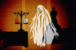 A still from an animation of a ghost measuring a heart and skull on scales of justice.