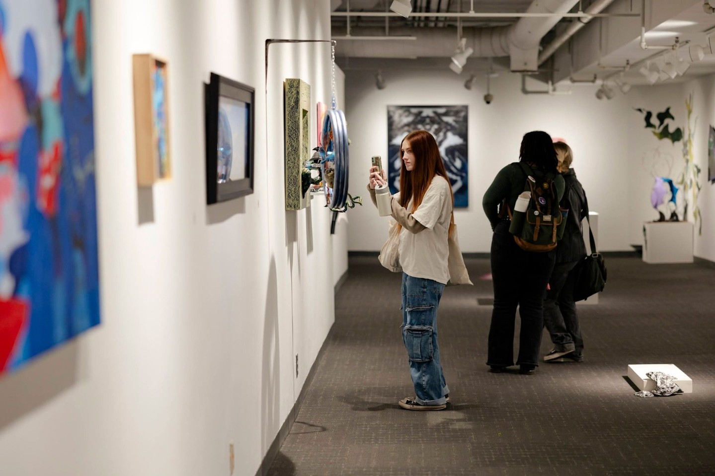 Patrons view artwork at the Milwaukee Institute of Art & Design.