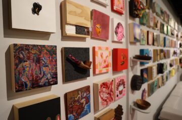 Rows of small square artwork at Var Gallery in Milwaukee.