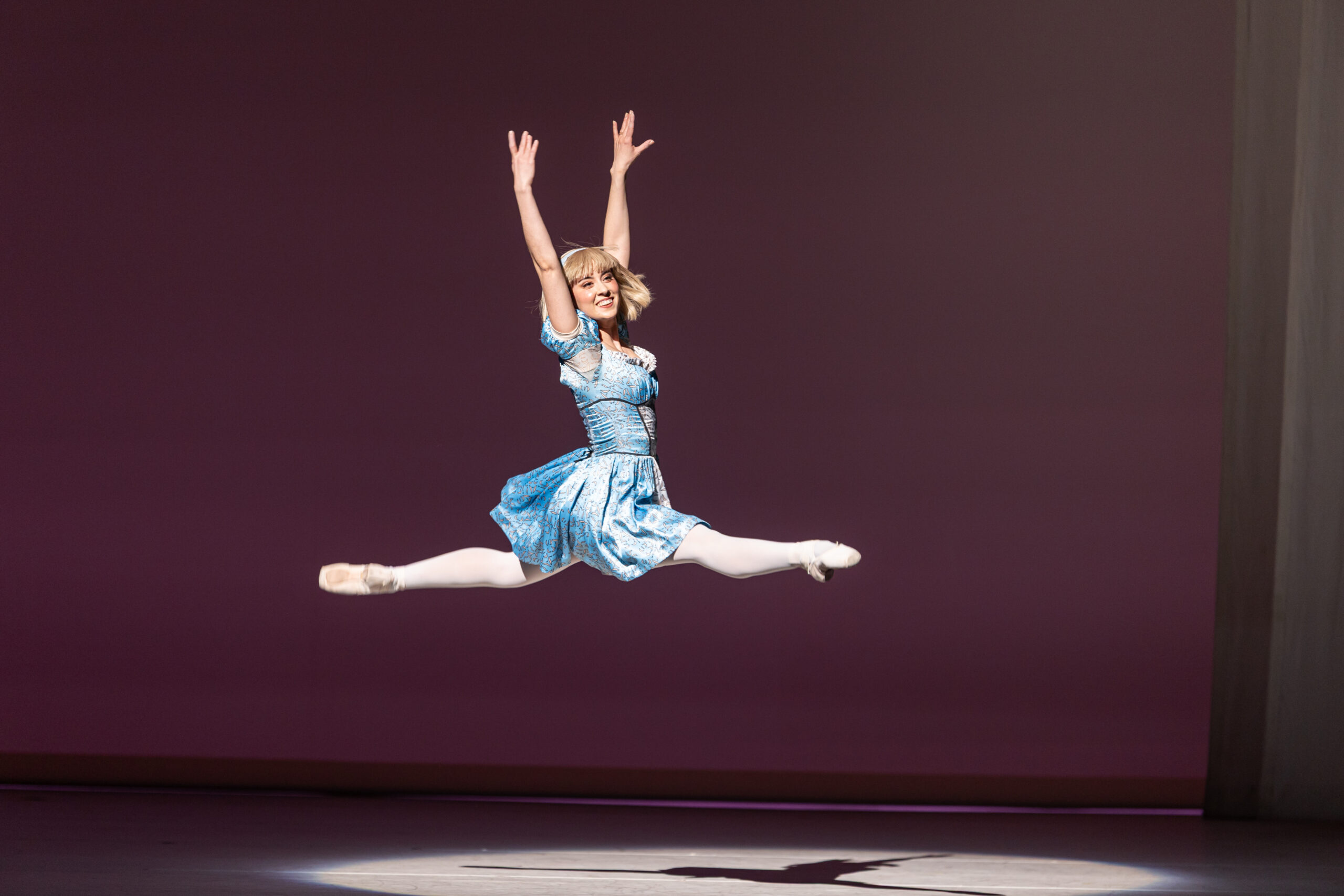 Alice leaps in a ballet production of "Alice (in wonderland)."