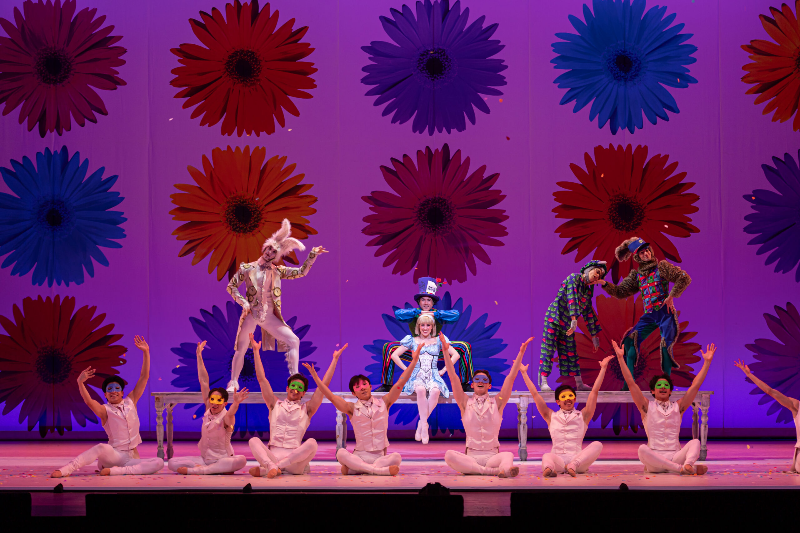 Alice with the Mad Hatter and the March Hare in a ballet production of "Alice (in wonderland)."