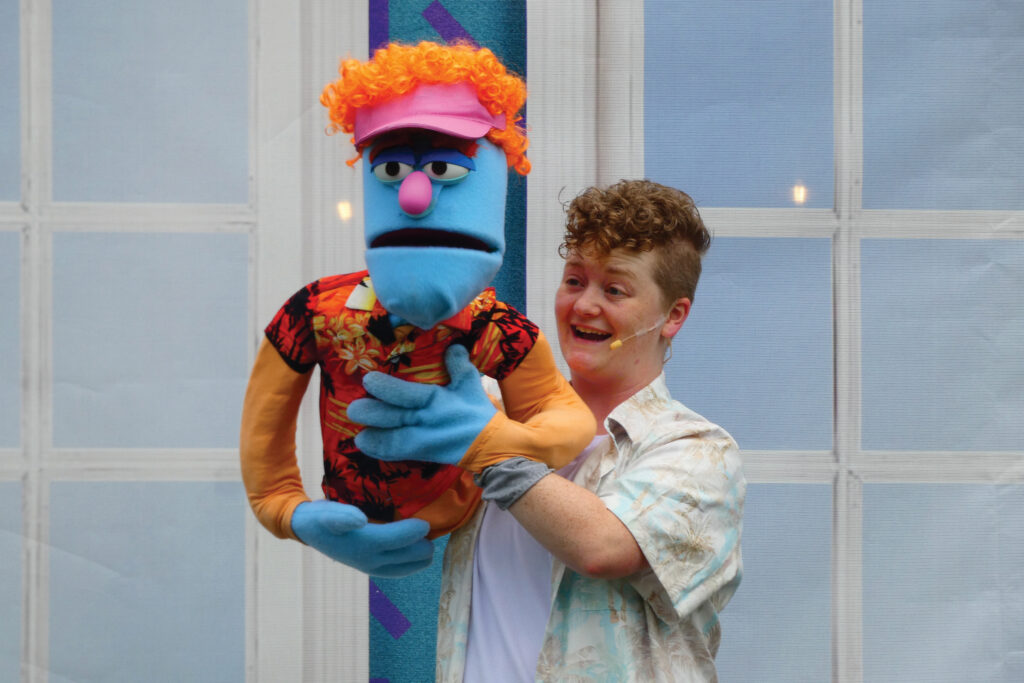 An actor works a puppet for a performance of Shakespeare in the Park in Milwaukee