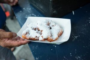 Fresh beignets dusted with powdered sugar.
