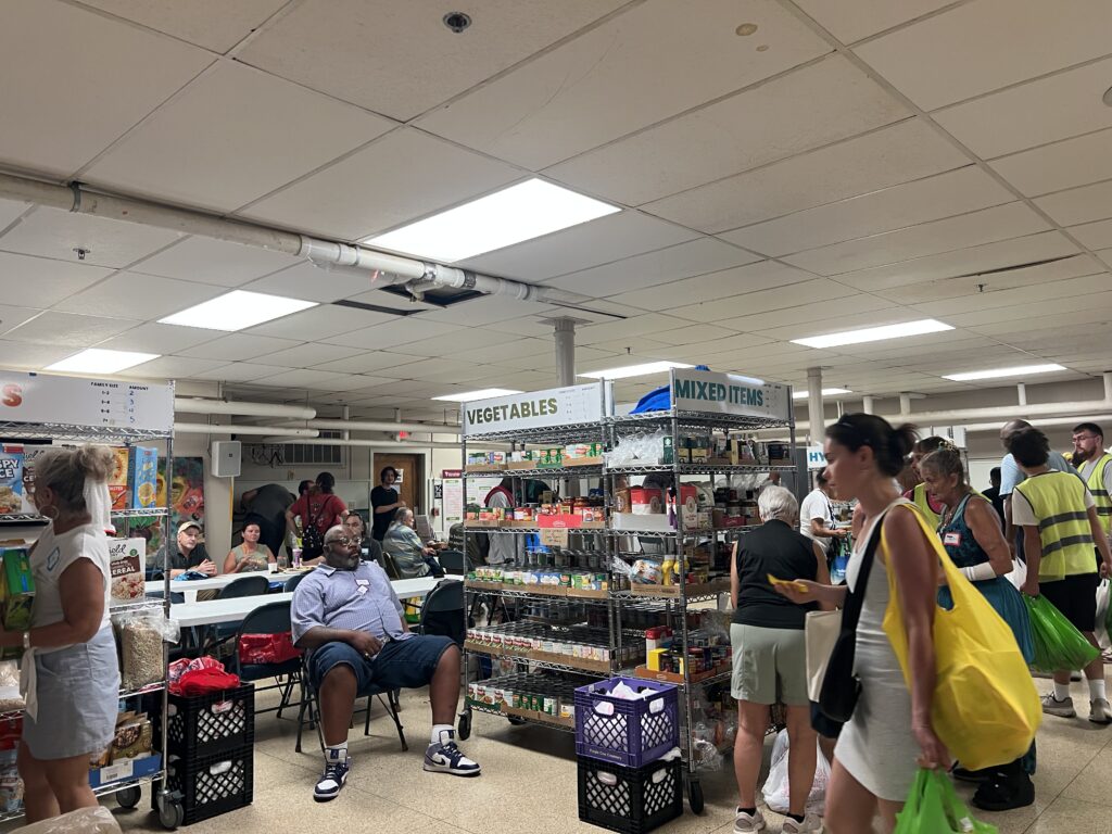 Crowded interior of the old Kinship Community Food Center