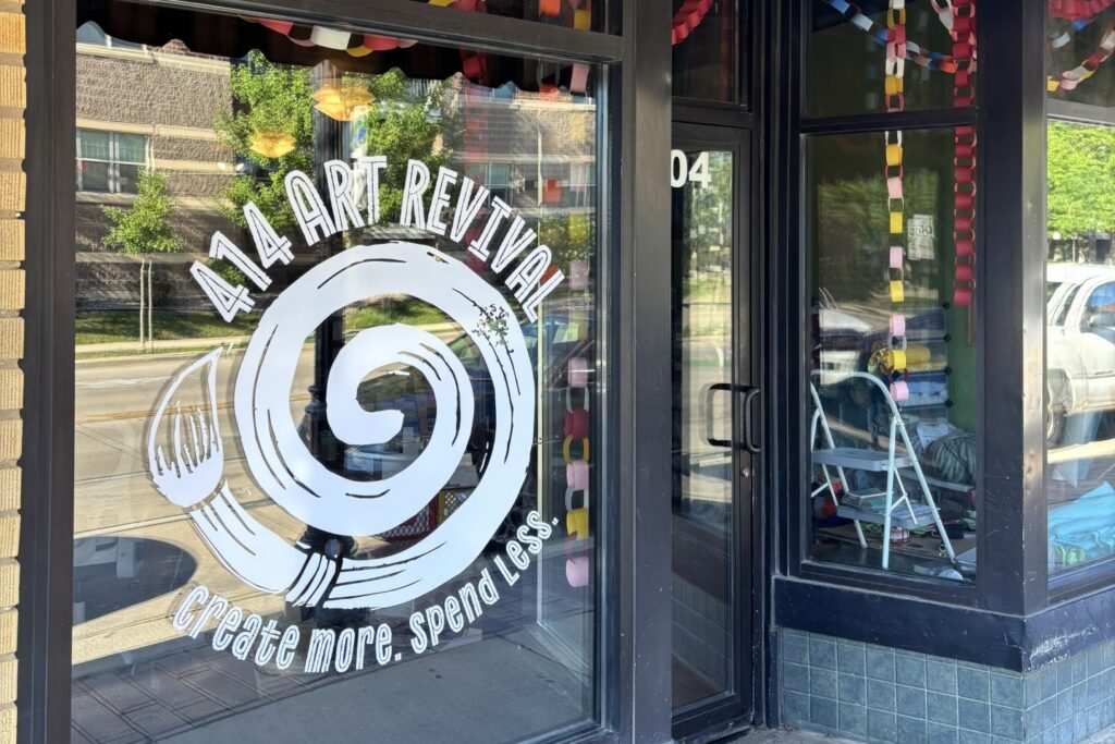 The facade of 414 Art Revival, featuring its spiral logo as a window decal.