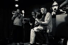 Two musicians jamming on stage