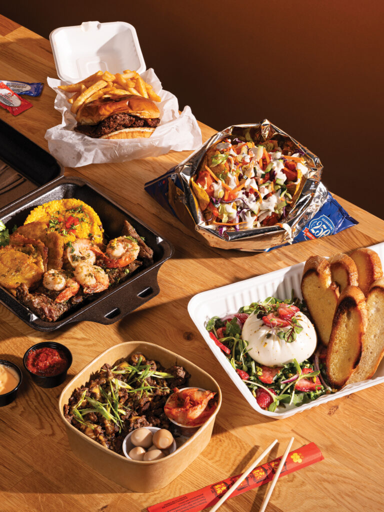 A spread of food on a wooden table.
