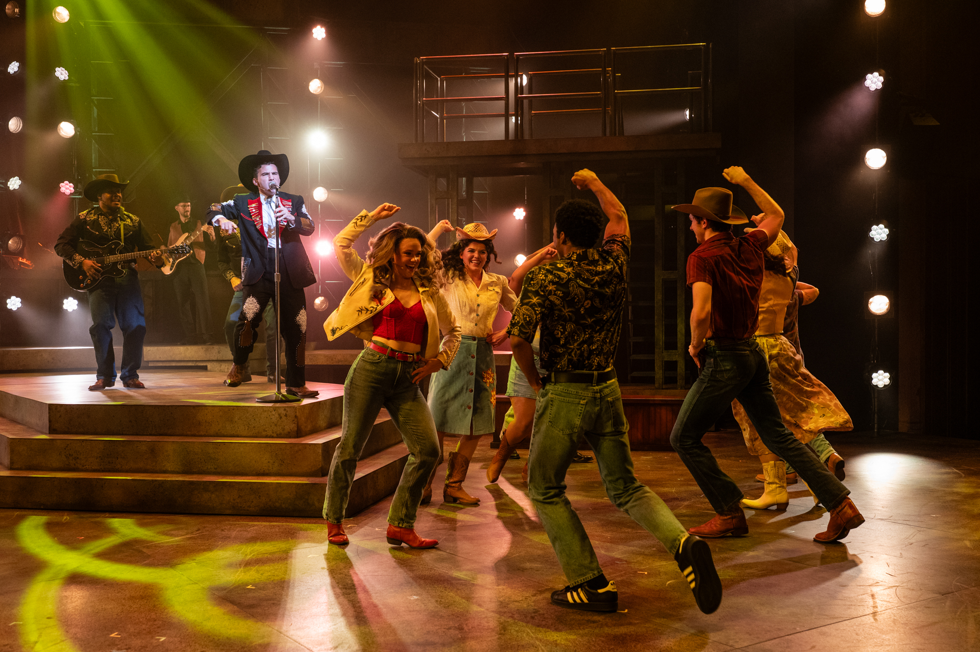 The cast of Milwaukee Rep's Footloose does a country-style dance.